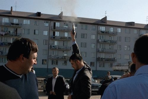 Men Are Shooting In The Air Celebrating The Upcoming Bride's Car At Aposh Wedding Party In Downtown Grozny